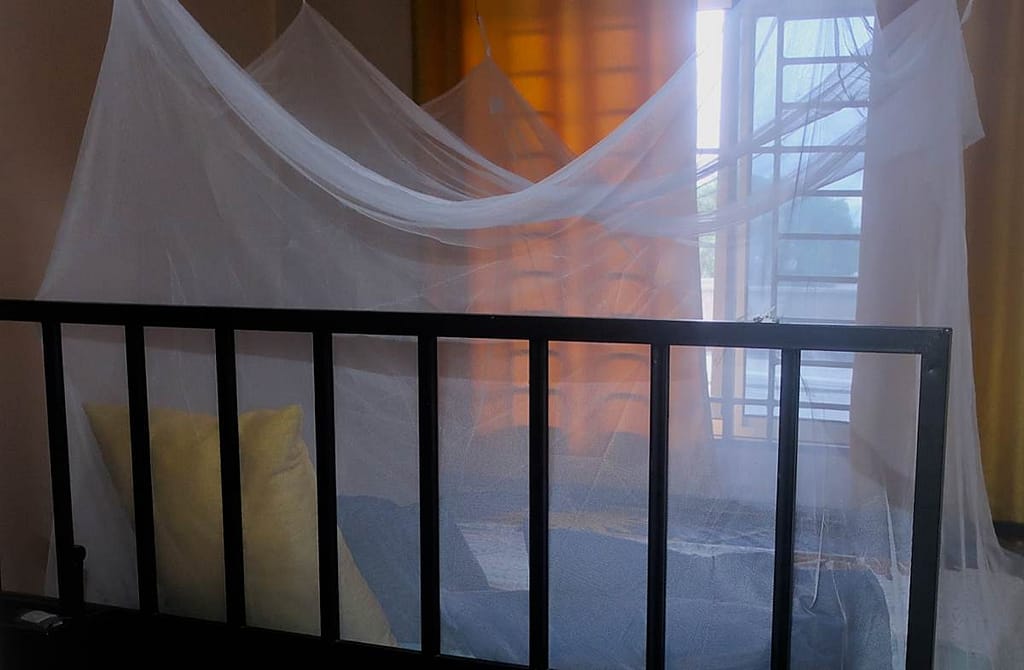Our bed, and of course we sleep under a mosquito net - one way we protect us against malaria